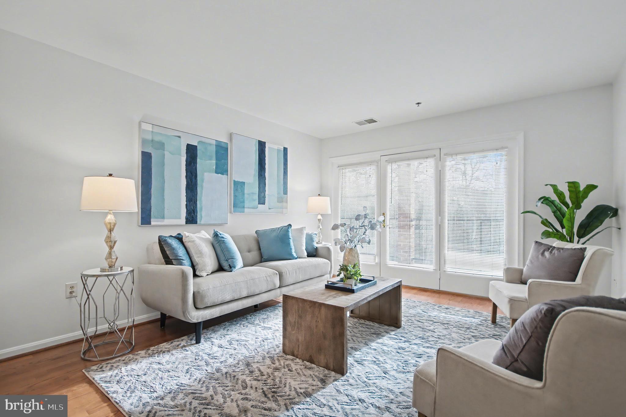 803 Coxswain Way, Unit 203 Annapolis, MD 21401 - Photo 1 of 44 a living room with furniture and a potted plant on table