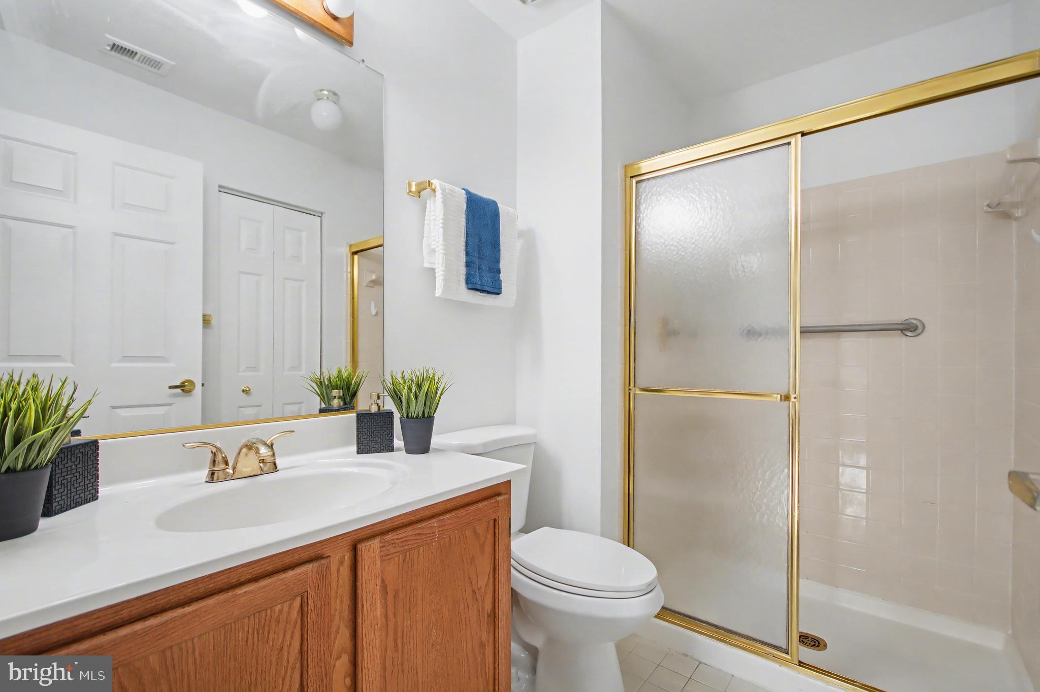 803 Coxswain Way, Unit 203 Annapolis, MD 21401 - Photo 15 of 44 a bathroom with a sink toilet and shower