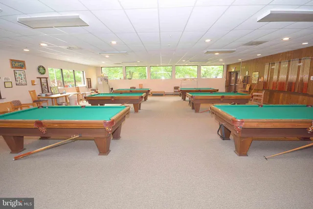 a utility room with multiple dryer and washer