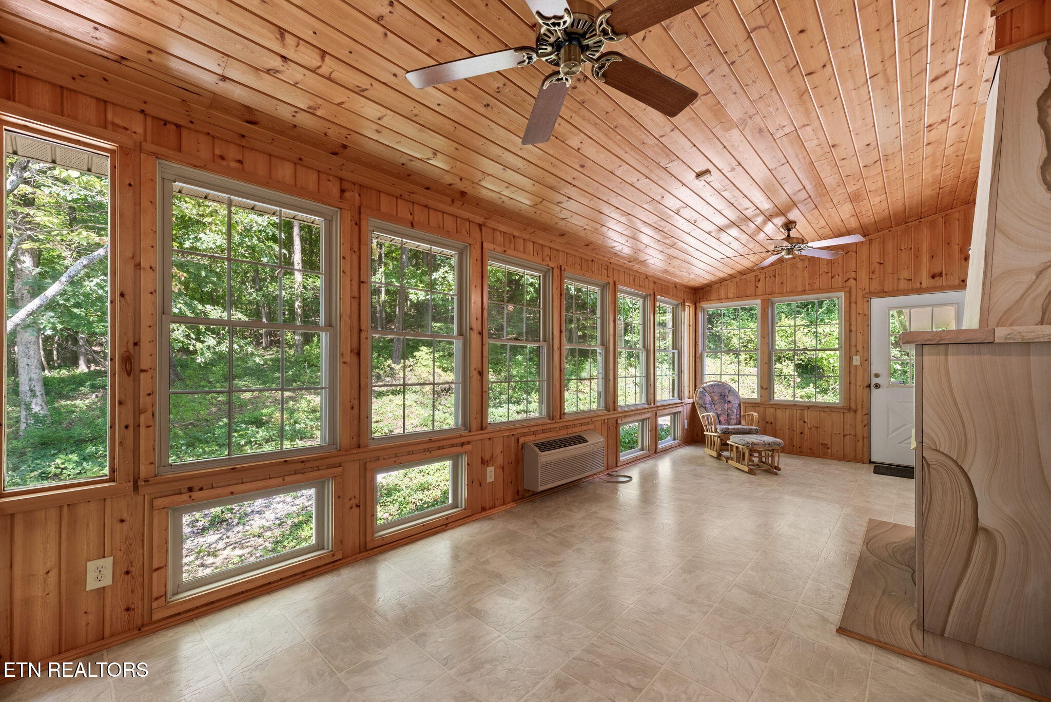 114 Canterbury Road Oak Ridge, TN 37830 - Photo 17 of 42 a living room with furniture floor to ceiling windows and a table