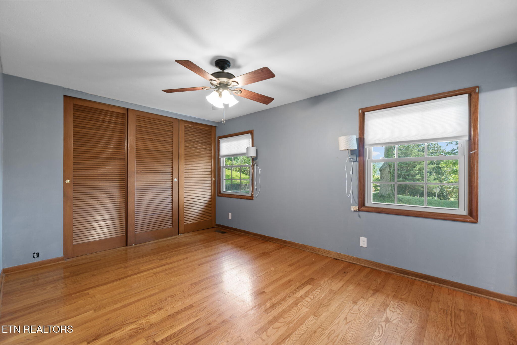 114 Canterbury Road Oak Ridge, TN 37830 - Photo 22 of 42 a view of an empty room with a window and wooden floor