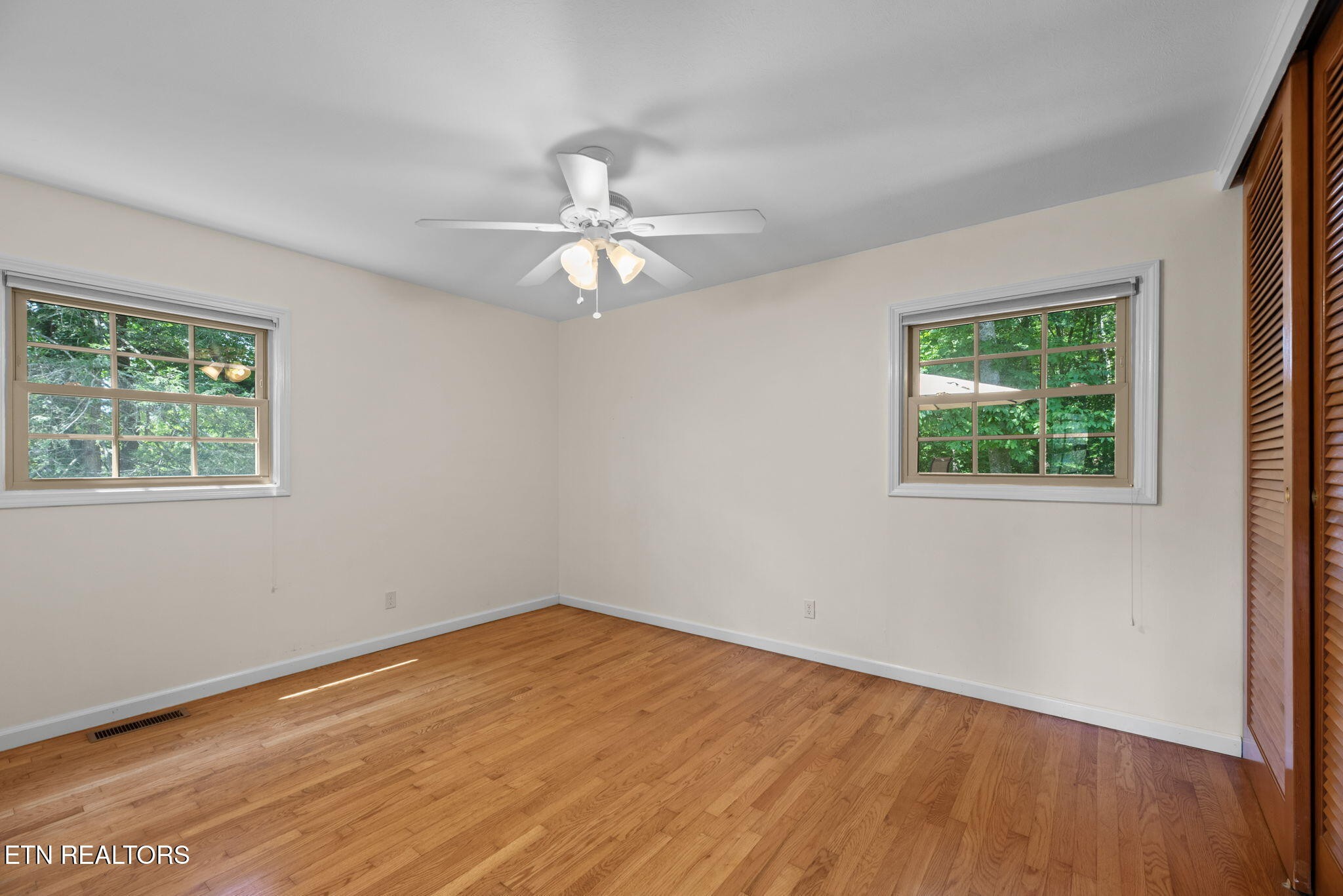 114 Canterbury Road Oak Ridge, TN 37830 - Photo 26 of 42 a view of empty room with wooden floor and fan