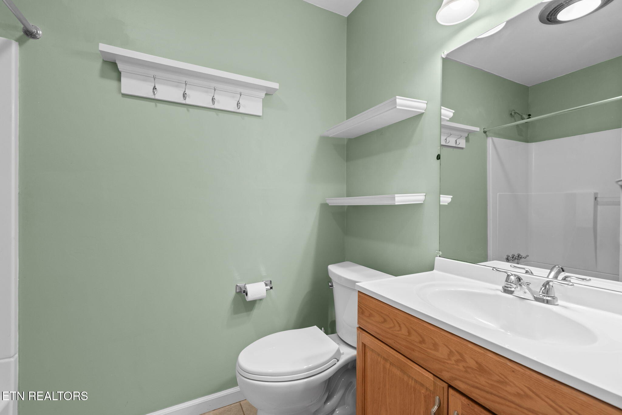 114 Canterbury Road Oak Ridge, TN 37830 - Photo 28 of 42 a bathroom with a sink mirror vanity and toilet