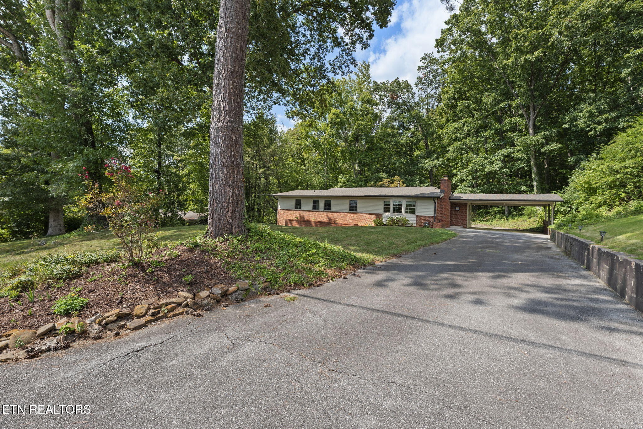 114 Canterbury Road Oak Ridge, TN 37830 - Photo 3 of 42 a house with trees in the background