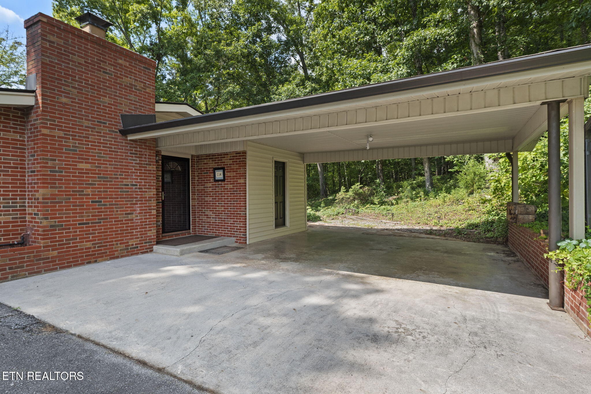 114 Canterbury Road Oak Ridge, TN 37830 - Photo 4 of 42 a view of a yard with porch and garden