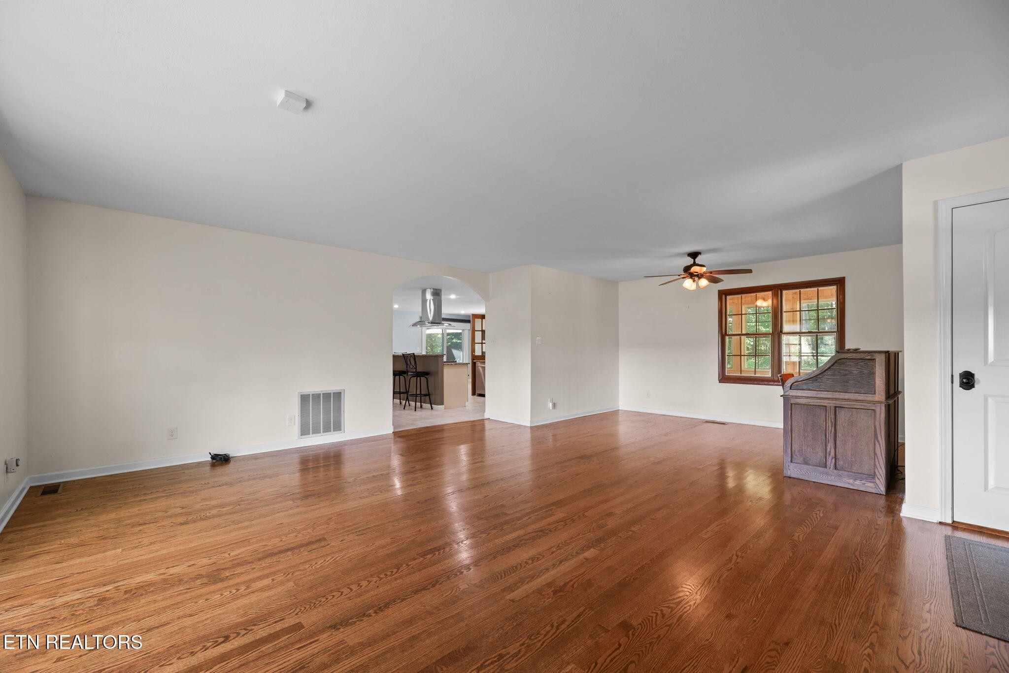114 Canterbury Road Oak Ridge, TN 37830 - Photo 8 of 42 a view of empty room with wooden floor and fan