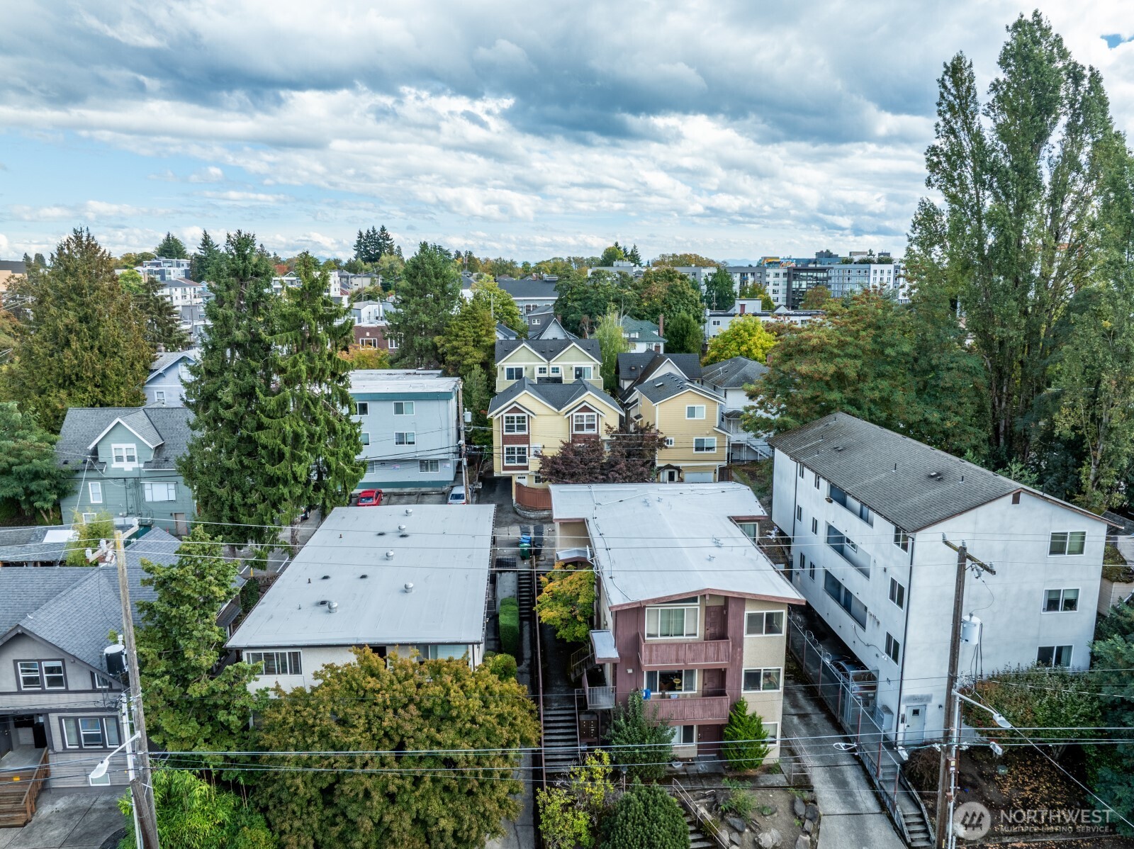 5045 11th Avenue Northeast Seattle, WA 98105 - Photo 3 of 11 an aerial view of multiple houses with a yard