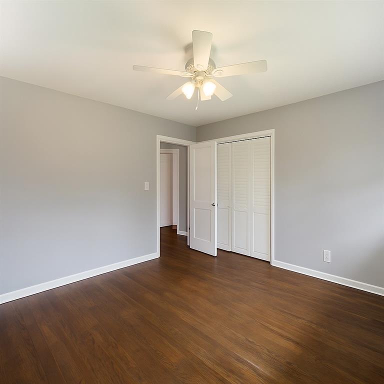 4329 Cedar Valley Lane Conley, GA 30288 - Photo 17 of 25 a view of an empty room with wooden floor