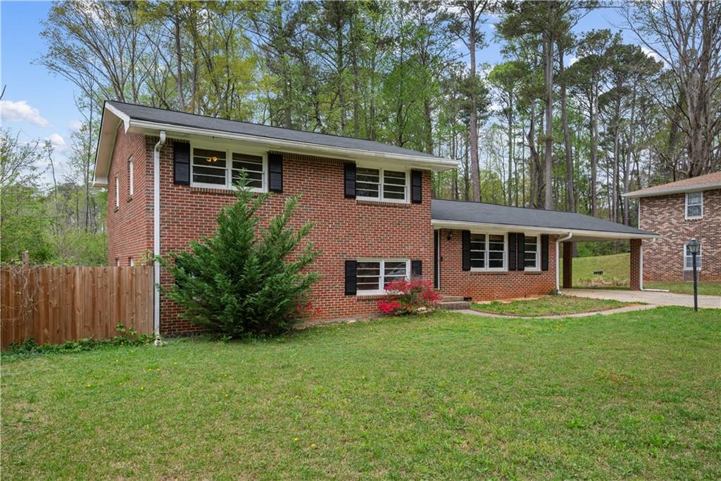 4329 Cedar Valley Lane Conley, GA 30288 - Photo 20 of 25 a front view of house with yard and green space