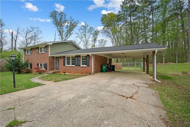 front view of a house with a yard