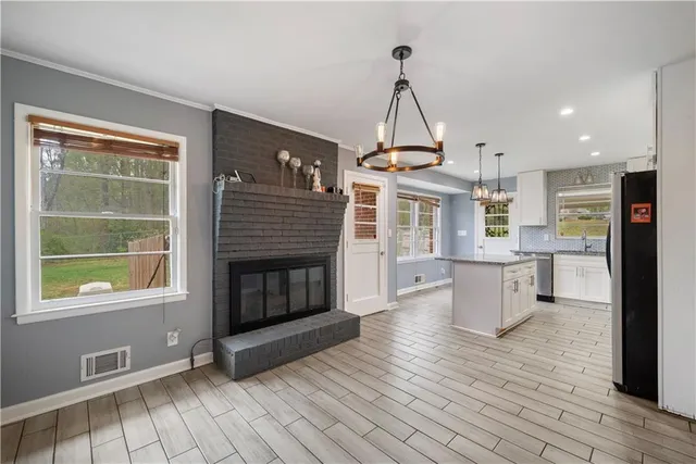 a view of a kitchen and dining room