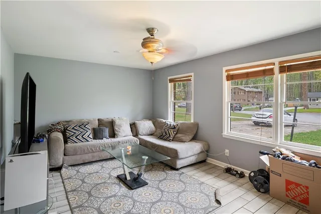 a living room with furniture and a window