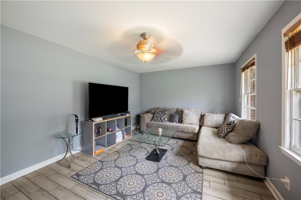 4329 Cedar Valley Lane Conley, GA 30288 - Photo 8 of 25 a living room with furniture and a flat screen tv