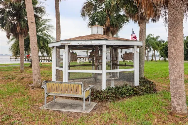a large room with lots of white furniture