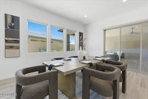 a kitchen with a sink a table and chairs