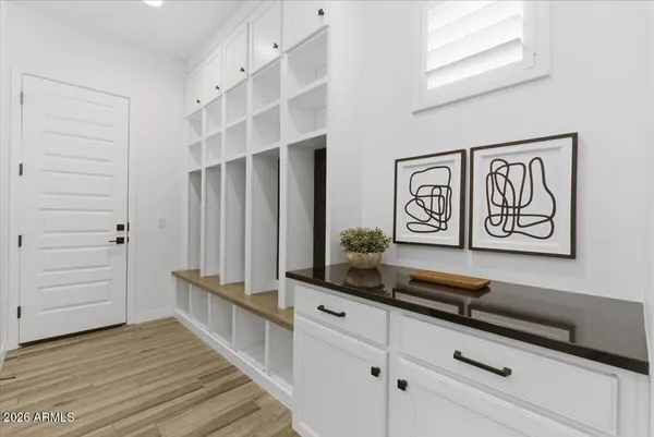a view of entryway with wooden floor