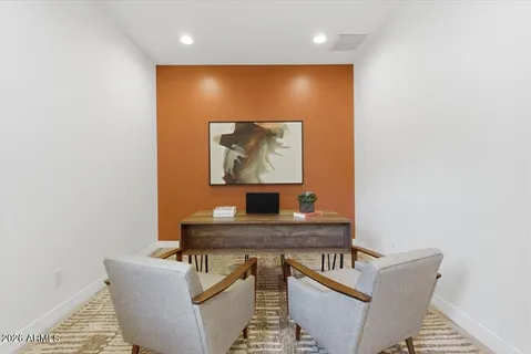 a view of a workspace with furniture