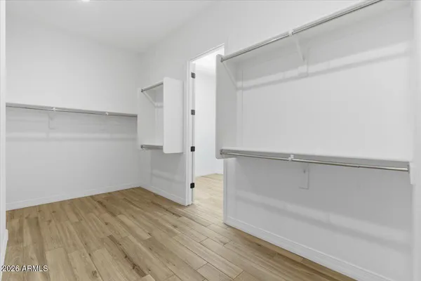 a view of a kitchen cabinets and wooden floor