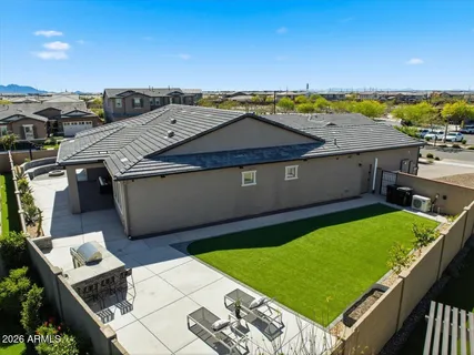 a view of a backyard with sitting area