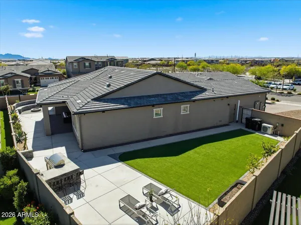 a view of a backyard with sitting area