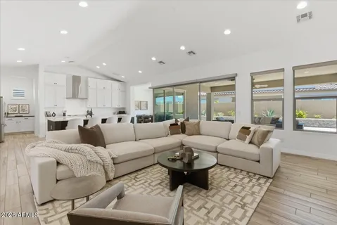 a living room with furniture and a large window