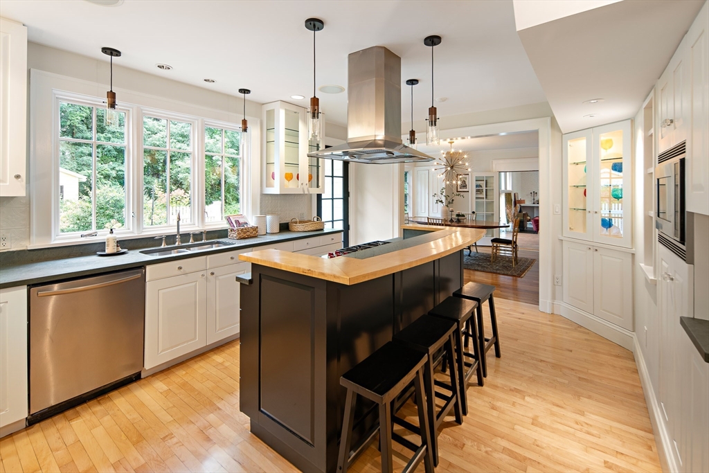 44 Ripley Hill Road Concord, MA 01742 - Photo 14 of 40 a kitchen with stainless steel appliances granite countertop a sink a stove and a refrigerator