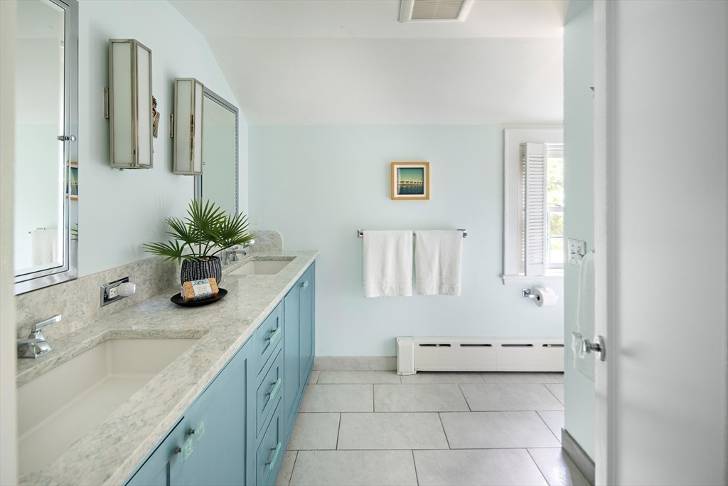44 Ripley Hill Road Concord, MA 01742 - Photo 20 of 40 a bathroom with a granite countertop sink and a mirror