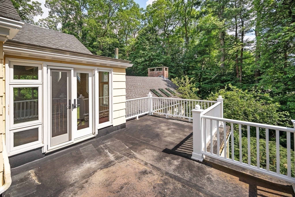 44 Ripley Hill Road Concord, MA 01742 - Photo 30 of 40 a view of a house with backyard and wooden fence