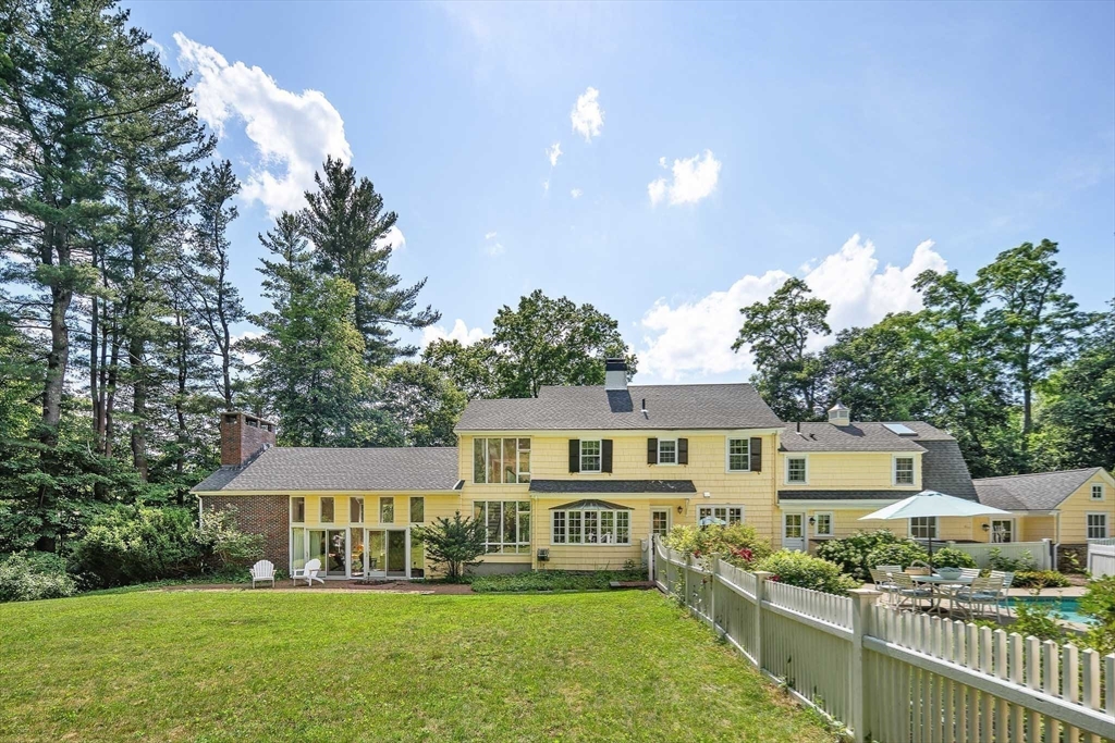 44 Ripley Hill Road Concord, MA 01742 - Photo 32 of 40 a front view of a house with a yard and green space