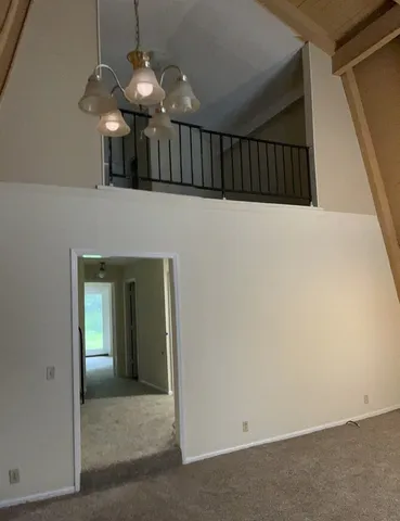 a view of a hallway with a chandelier