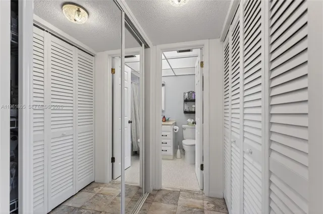 a view of a bathroom from a hallway