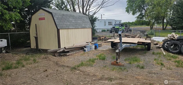 a view of backyard with outdoor seating