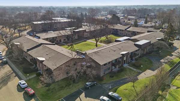 an aerial view of a house with a swimming pool