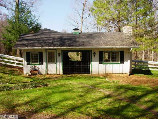 237 Williams Road Mocksville, NC 27028 - Photo 11 of 16 Stable/Barn. Front View of 3/4 Barn complete with office and fire place.