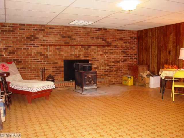 237 Williams Road Mocksville, NC 27028 - Photo 8 of 16 Den/Family/Great Room. Basement Den with Fully Functional Wood Stove.