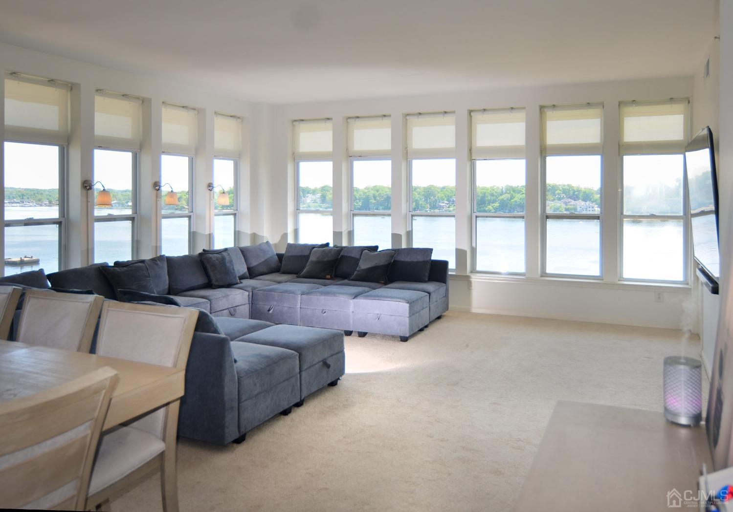 358 Rector Street, Unit 710 Perth Amboy, NJ 08861 - Photo 3 of 35 a living room with furniture and large windows