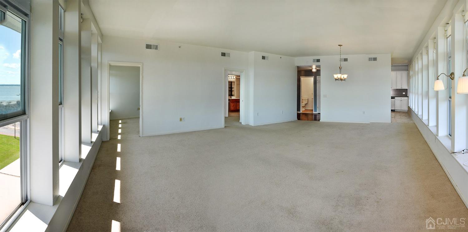 358 Rector Street, Unit 710 Perth Amboy, NJ 08861 - Photo 34 of 35 a view of empty room with wooden floor
