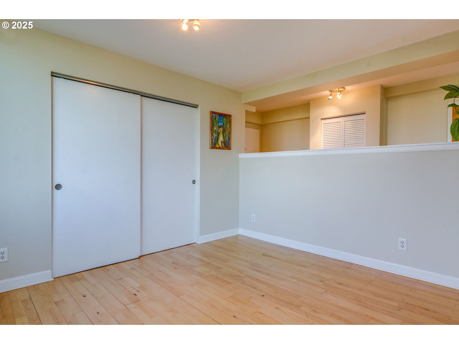 1205 Southwest Cardinell Drive, Unit 302 Portland, OR 97201 - Photo 15 of 23 a view of an empty room with wooden floor and a window