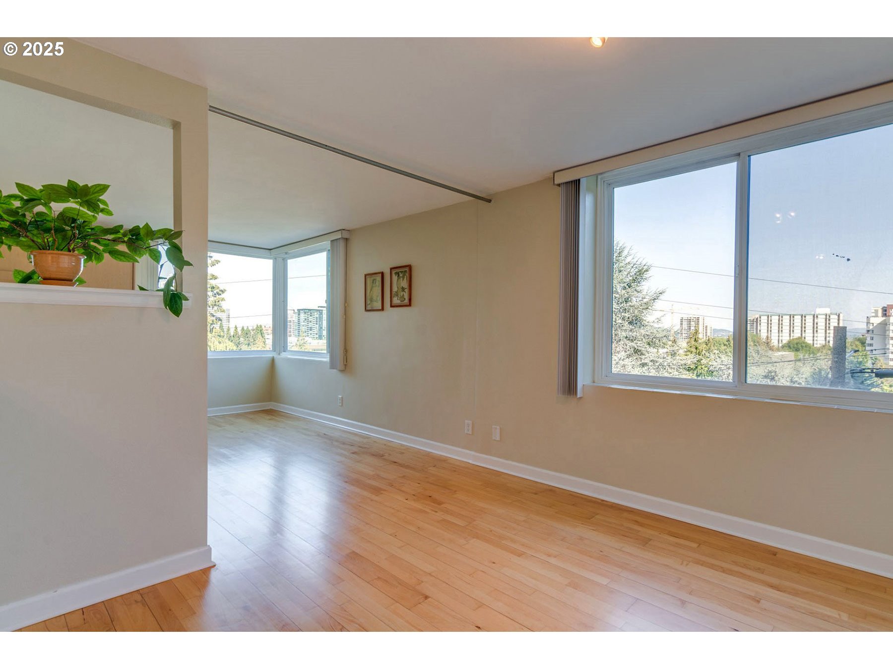 1205 Southwest Cardinell Drive, Unit 302 Portland, OR 97201 - Photo 17 of 23 an empty room with wooden floor and windows
