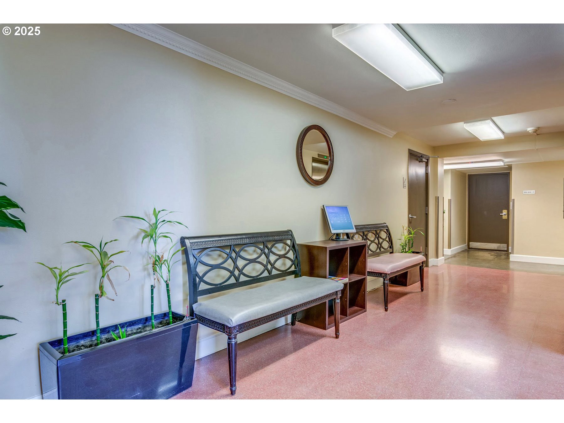 1205 Southwest Cardinell Drive, Unit 302 Portland, OR 97201 - Photo 22 of 23 a living room with furniture and a wooden floor