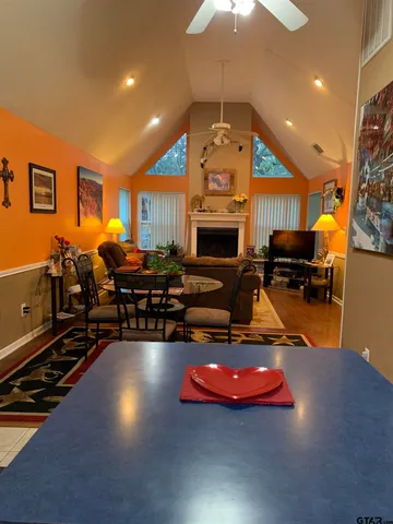 a bathroom with a sink a toilet and shower curtain