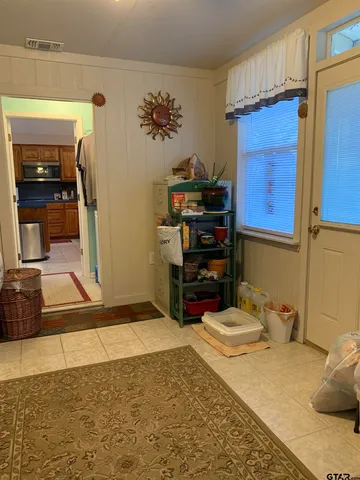 a bedroom with a bed and a tv