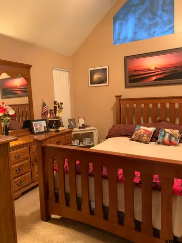 a bedroom with a bed and closet