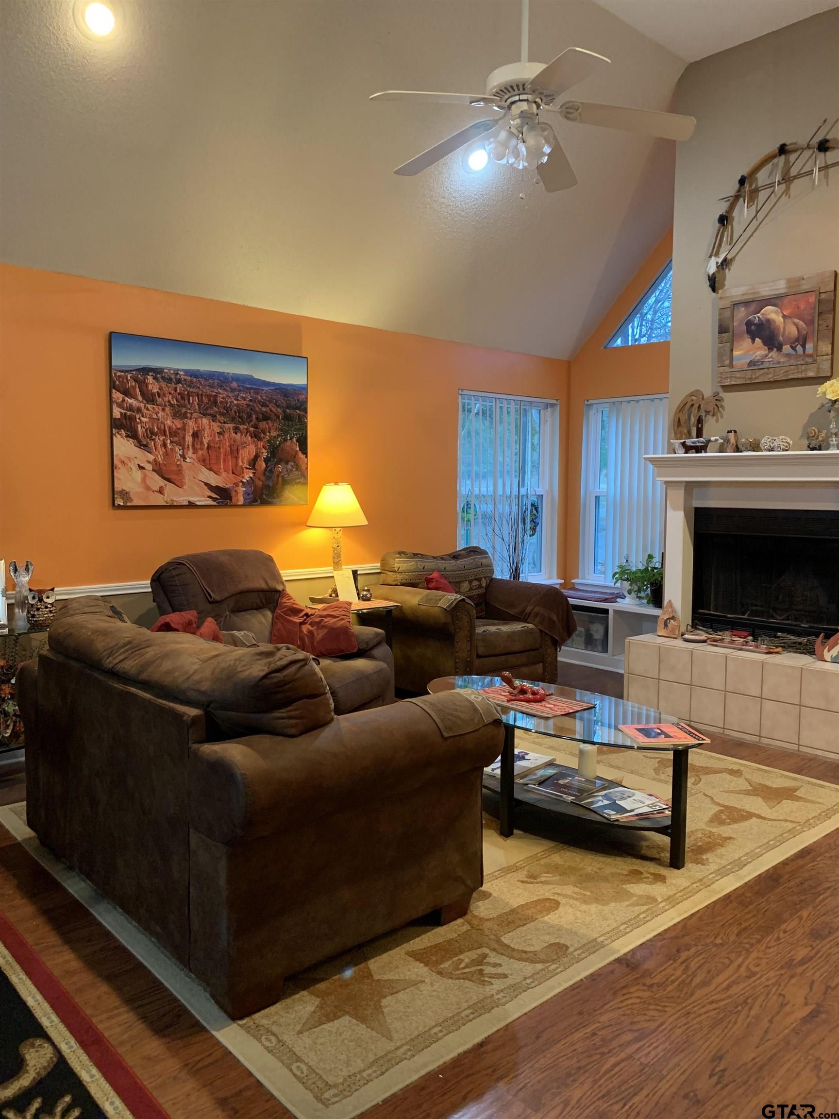 399 Cimarron Trail Holly Lake Ranch, TX 75765 - Photo 4 of 24 a living room with furniture and a fireplace