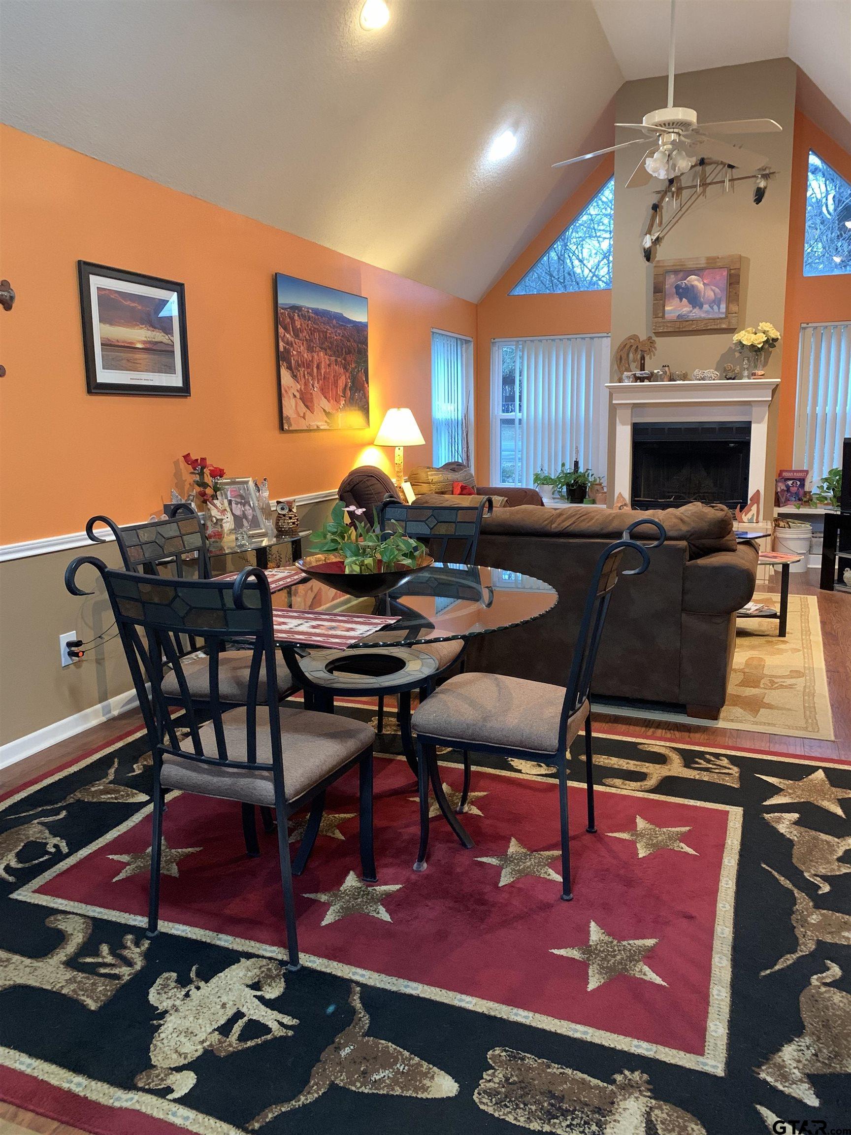 399 Cimarron Trail Holly Lake Ranch, TX 75765 - Photo 7 of 24 a living room with furniture a rug and a fireplace