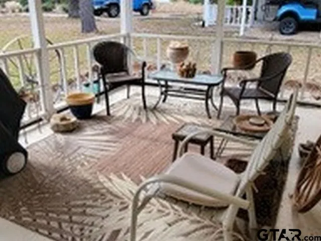 a living room with furniture and a rug