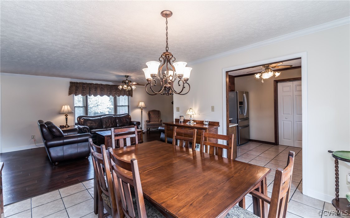 10623 River Road Chesterfield, VA 23838 - Photo 17 of 48 a dining room with furniture a chandelier and window