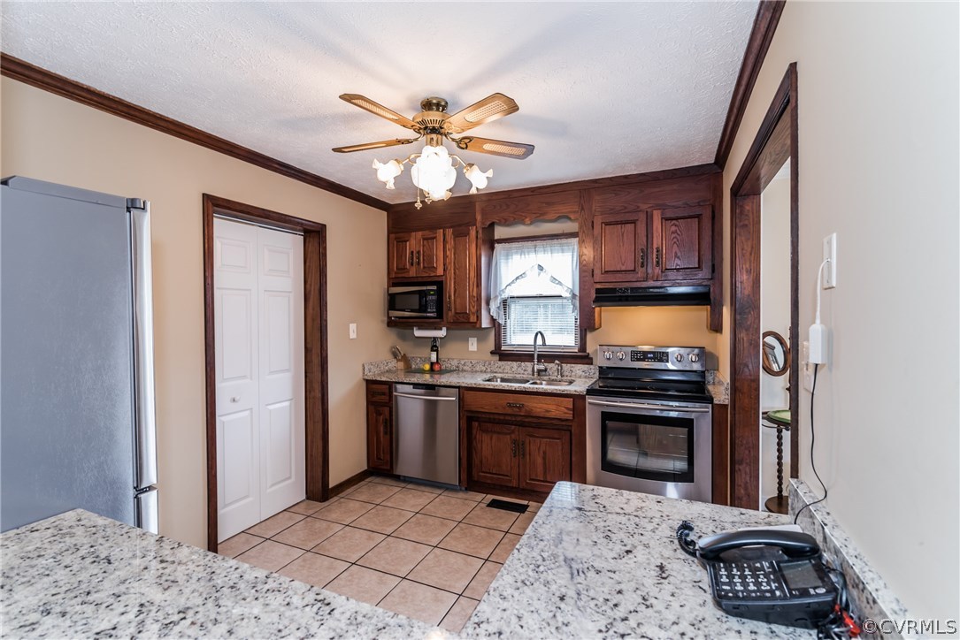 10623 River Road Chesterfield, VA 23838 - Photo 23 of 48 a kitchen with stainless steel appliances granite countertop a refrigerator a stove a sink and a microwave