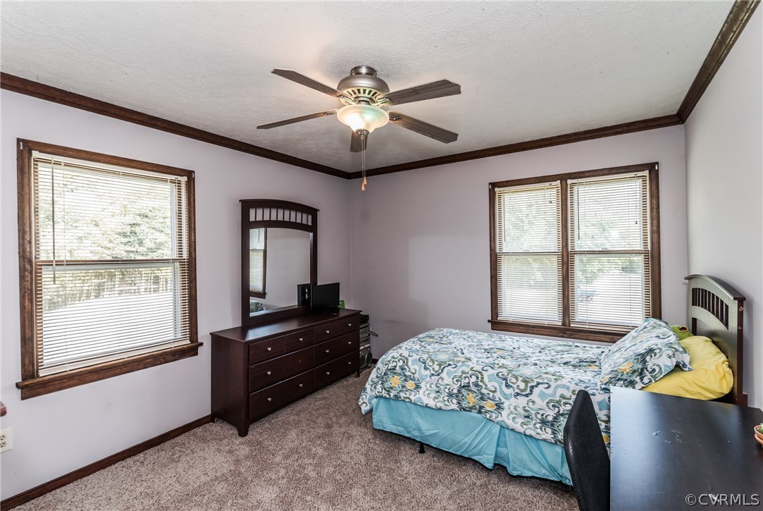 10623 River Road Chesterfield, VA 23838 - Photo 29 of 48 a bedroom with a bed and a window