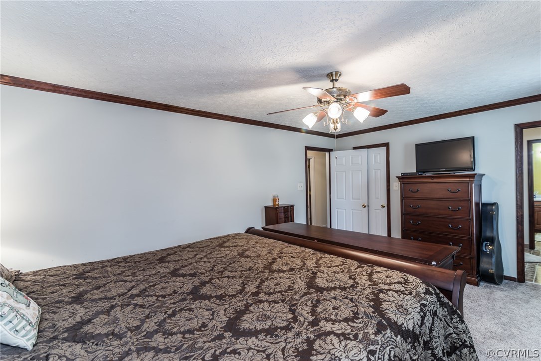 10623 River Road Chesterfield, VA 23838 - Photo 34 of 48 a bedroom with a bed and a flat screen tv